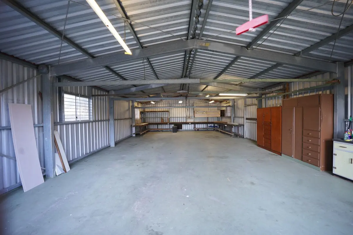 Large empty warehouse with a swept concrete floor